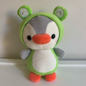 Penguin in frog costume stuffed animal